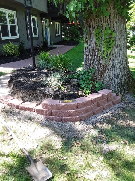 Wrapping plant bed stacked block wall finished